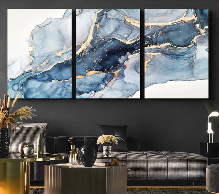 An abstract art print with fluid blue and gold hangs elegantly on the wall.