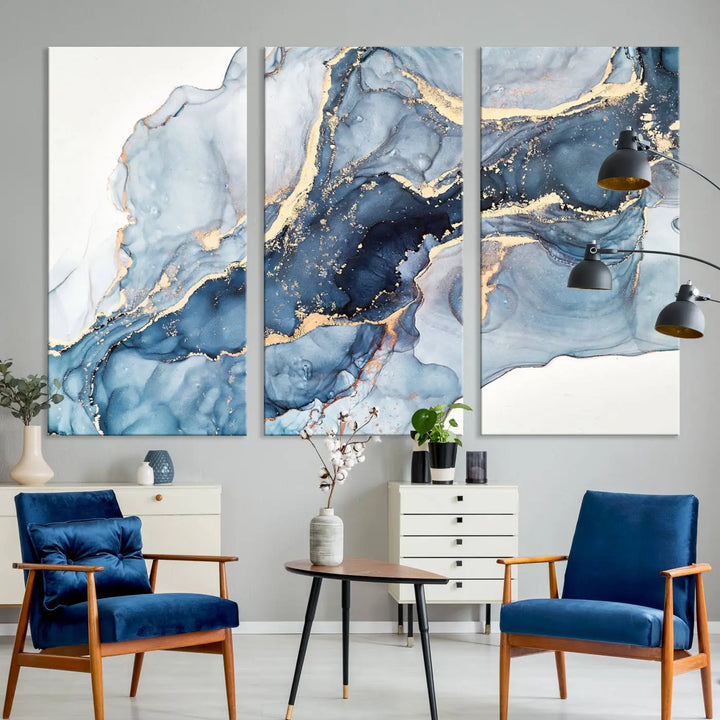 An abstract art print with fluid blue and gold hangs elegantly on the wall.