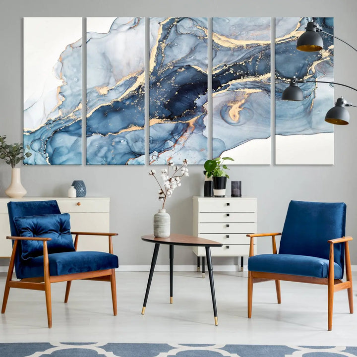 An abstract art print with fluid blue and gold hangs elegantly on the wall.