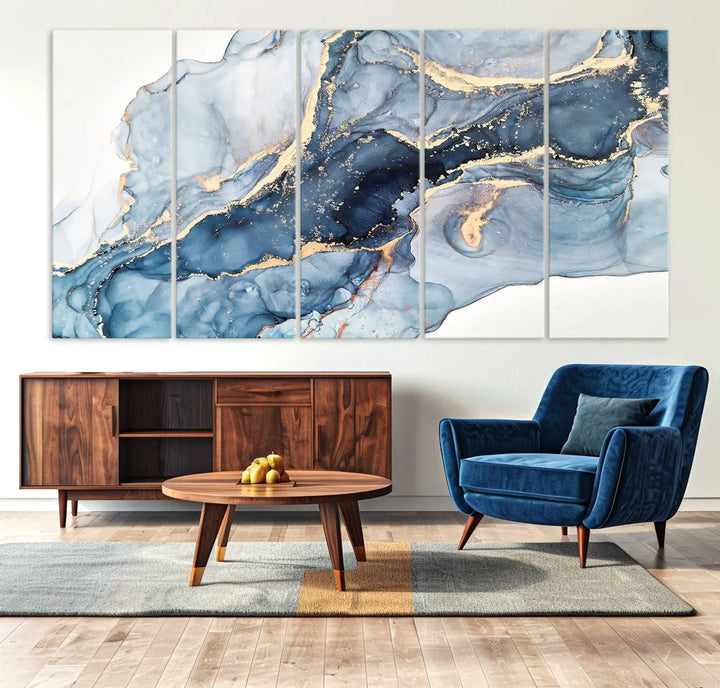 An abstract art print with fluid blue and gold hangs elegantly on the wall.