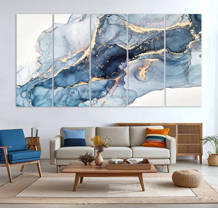 An abstract art print with fluid blue and gold hangs elegantly on the wall.