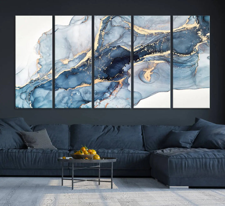 An abstract art print with fluid blue and gold hangs elegantly on the wall.