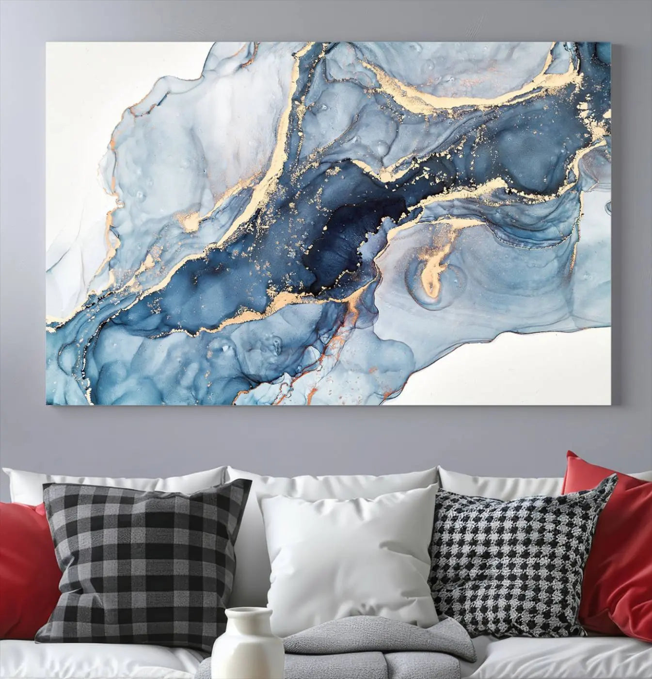 The living room showcases a striking Abstract Art Print - Blue Abstract Canvas Wall Art, featuring fluid effect artwork in vibrant blue and gold tones.