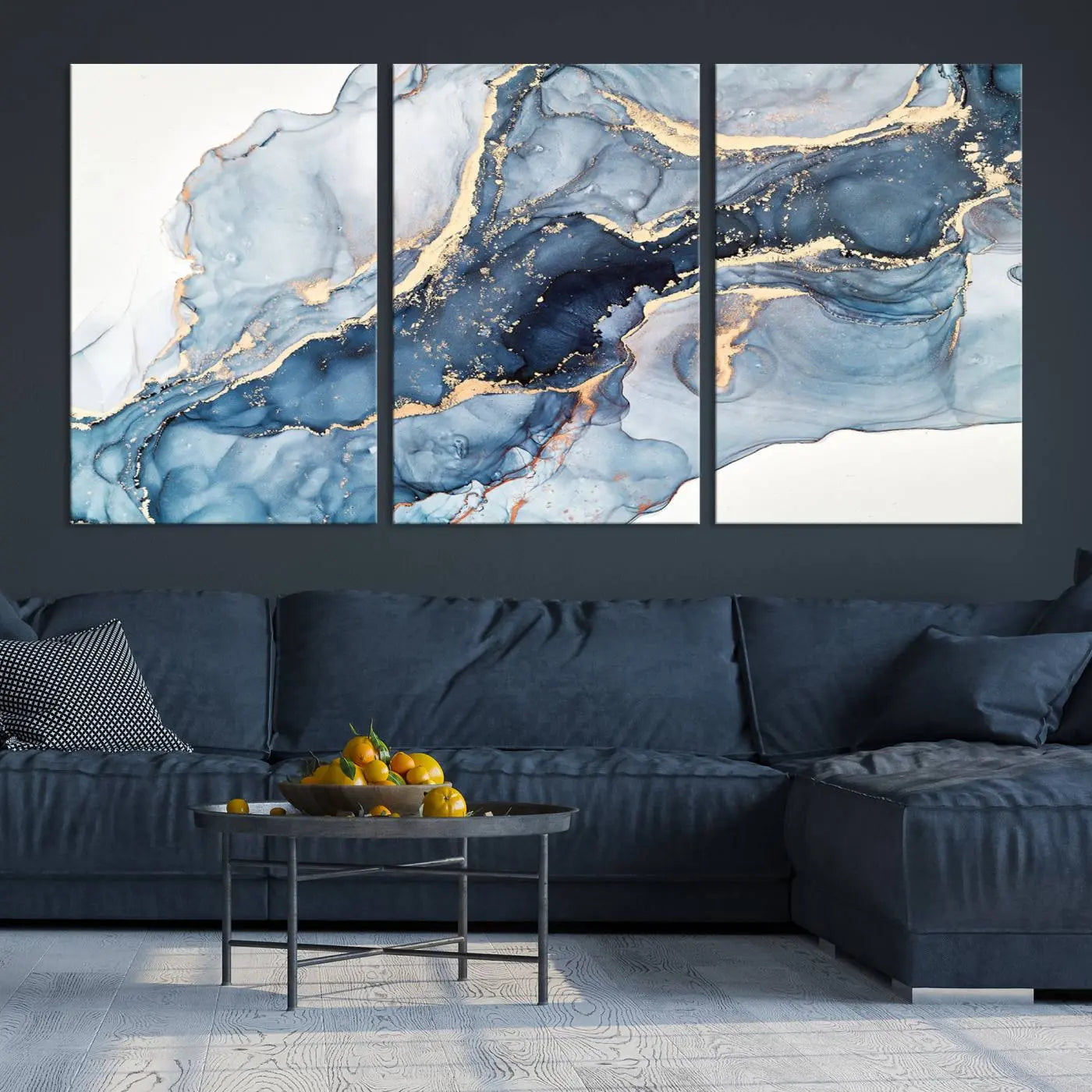 The living room showcases a striking Abstract Art Print - Blue Abstract Canvas Wall Art, featuring fluid effect artwork in vibrant blue and gold tones.