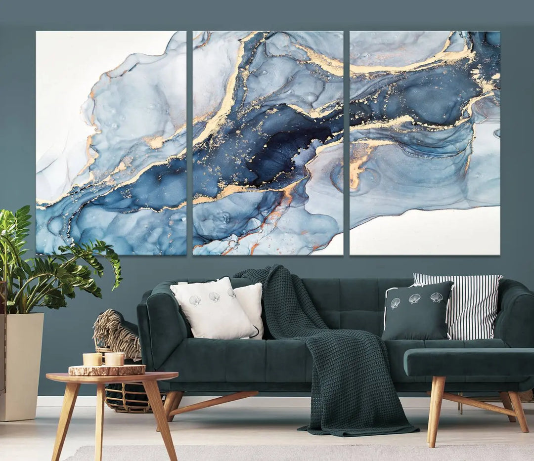 The living room showcases a striking Abstract Art Print - Blue Abstract Canvas Wall Art, featuring fluid effect artwork in vibrant blue and gold tones.