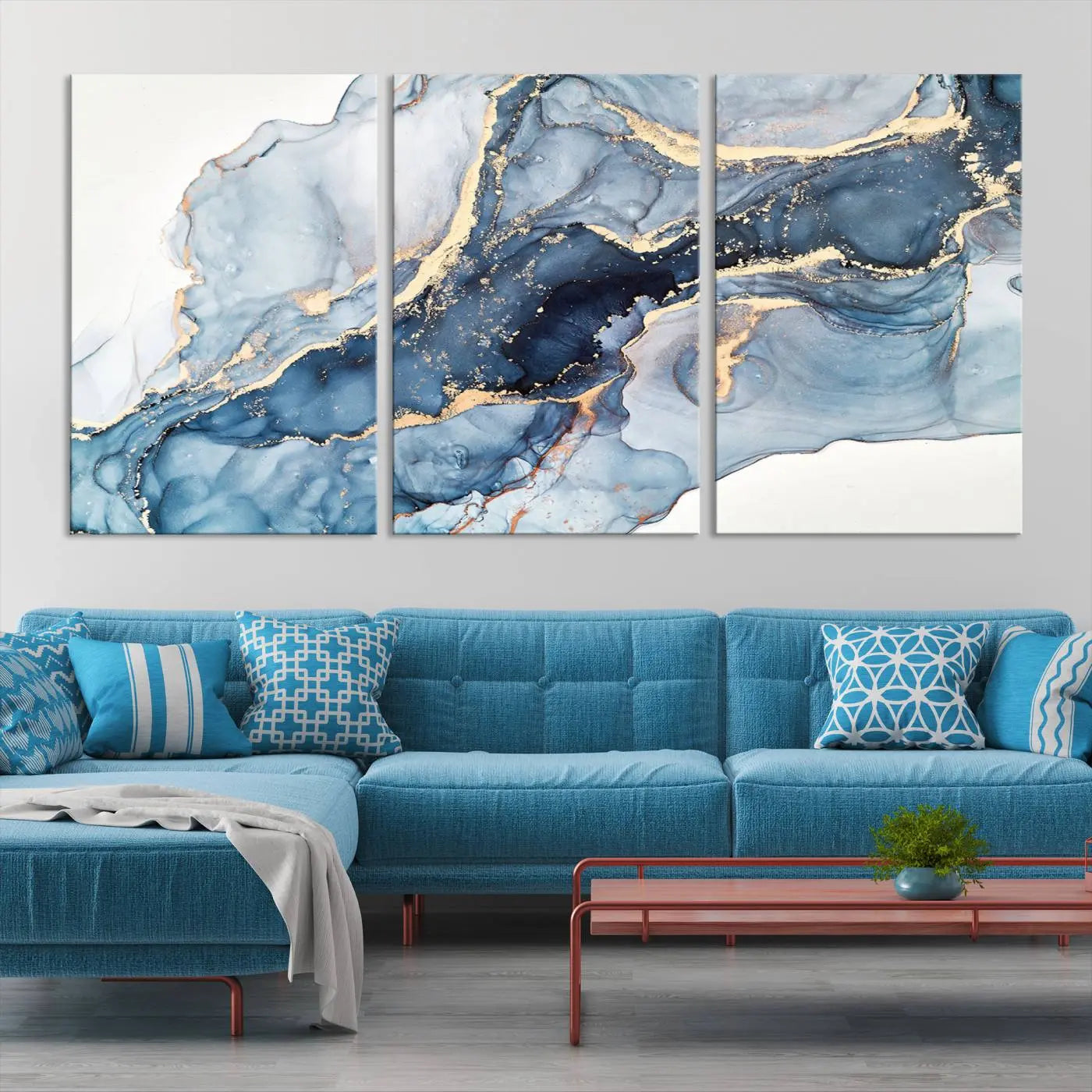 The living room showcases a striking Abstract Art Print - Blue Abstract Canvas Wall Art, featuring fluid effect artwork in vibrant blue and gold tones.