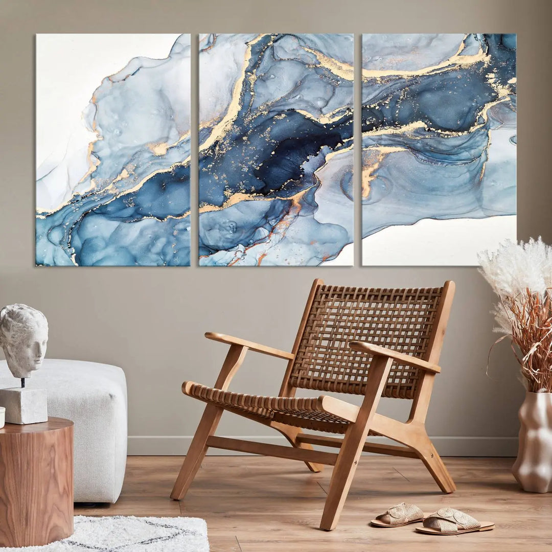 The living room showcases a striking Abstract Art Print - Blue Abstract Canvas Wall Art, featuring fluid effect artwork in vibrant blue and gold tones.