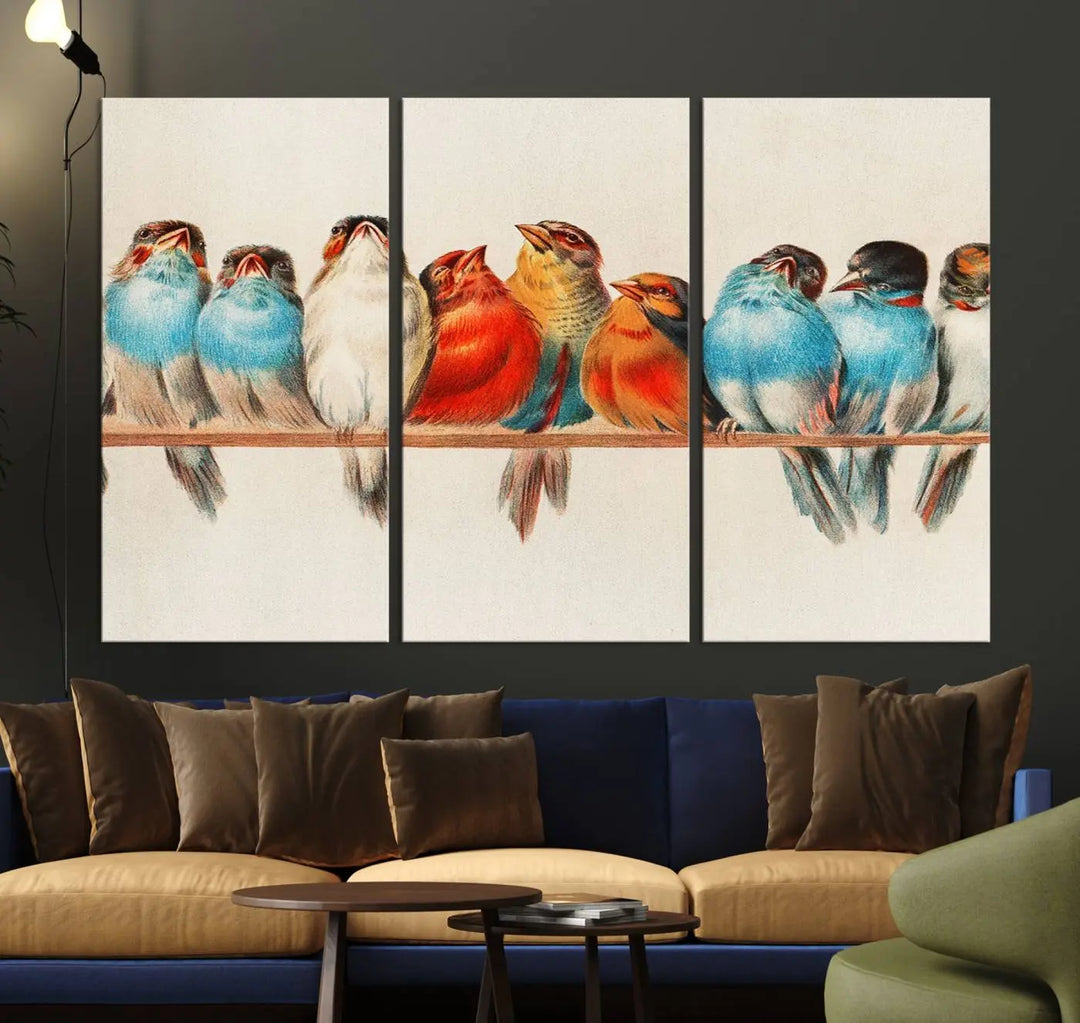 The Abstract Birds Wall Art Canvas Print, featuring a triptych of colorful birds perched on a branch, is printed on museum-quality canvas and equipped with a UV-protective coating and ready-to-hang design. This artwork adds vibrant elegance to your living space.