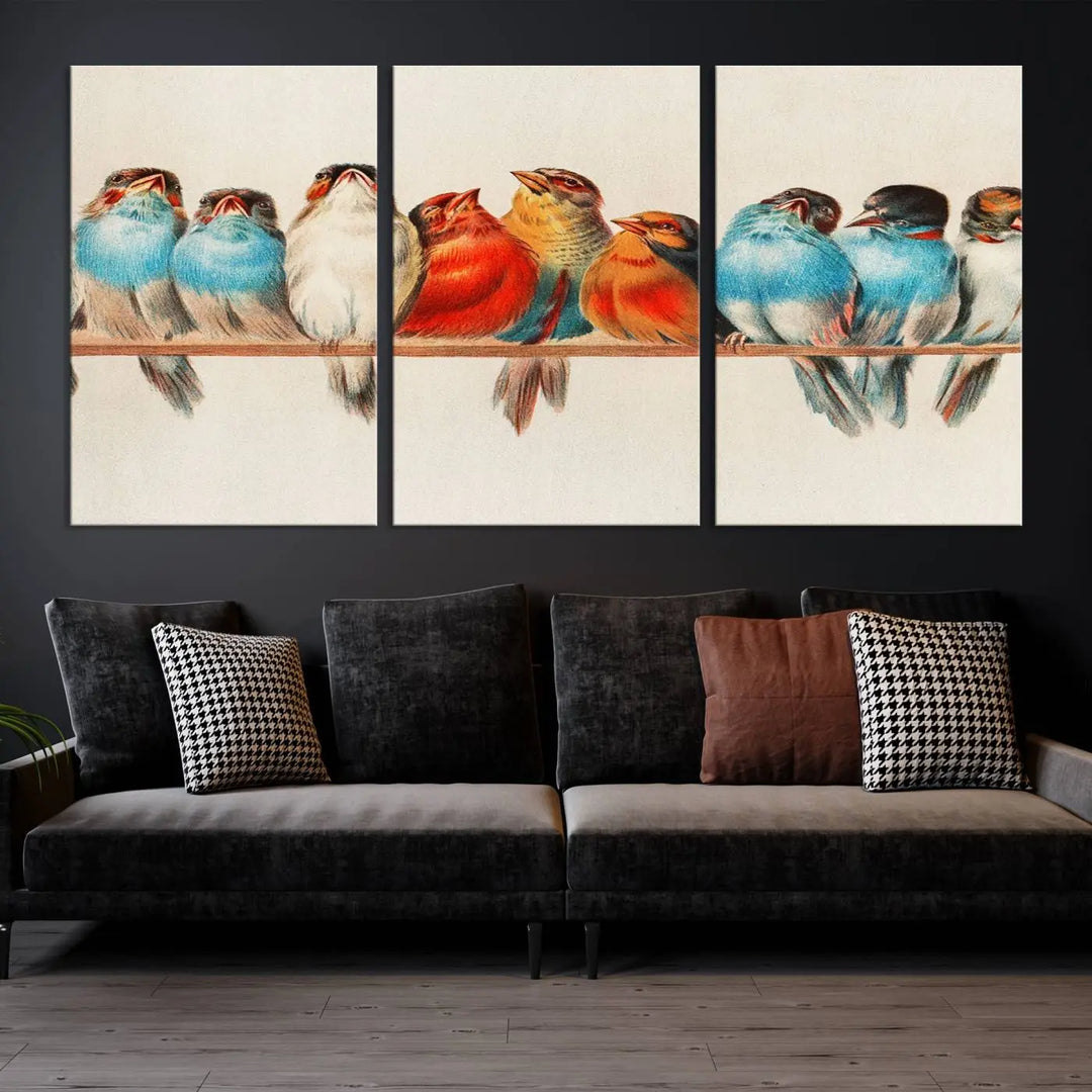 The Abstract Birds Wall Art Canvas Print, featuring a triptych of colorful birds perched on a branch, is printed on museum-quality canvas and equipped with a UV-protective coating and ready-to-hang design. This artwork adds vibrant elegance to your living space.