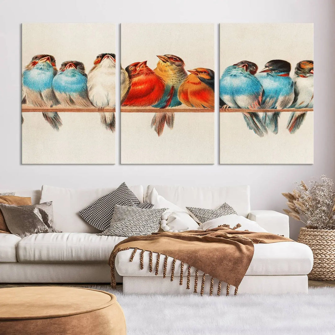 The Abstract Birds Wall Art Canvas Print, featuring a triptych of colorful birds perched on a branch, is printed on museum-quality canvas and equipped with a UV-protective coating and ready-to-hang design. This artwork adds vibrant elegance to your living space.