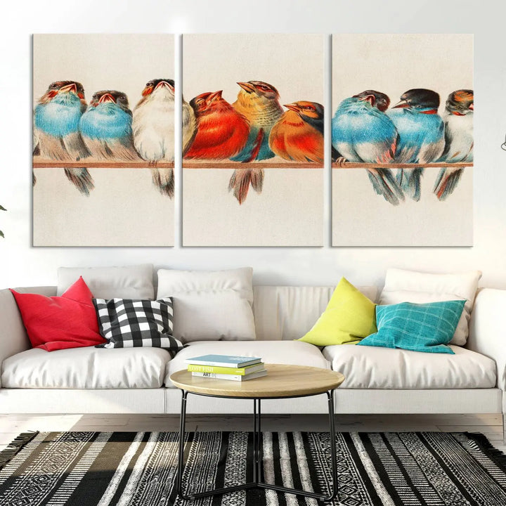 The Abstract Birds Wall Art Canvas Print, featuring a triptych of colorful birds perched on a branch, is printed on museum-quality canvas and equipped with a UV-protective coating and ready-to-hang design. This artwork adds vibrant elegance to your living space.