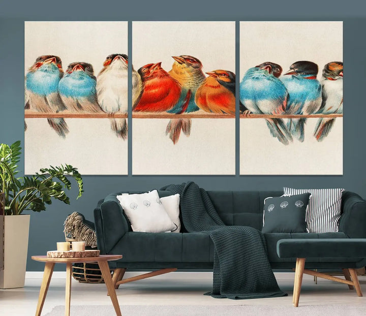 The Abstract Birds Wall Art Canvas Print, featuring a triptych of colorful birds perched on a branch, is printed on museum-quality canvas and equipped with a UV-protective coating and ready-to-hang design. This artwork adds vibrant elegance to your living space.