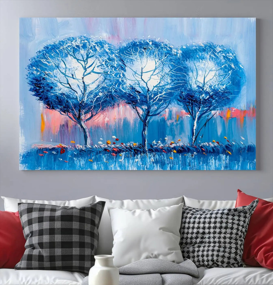 The living room showcases the Abstract Blue Trees Trendy Wall Art Canvas Print, elegantly featuring a triptych of blue trees against a pink background.