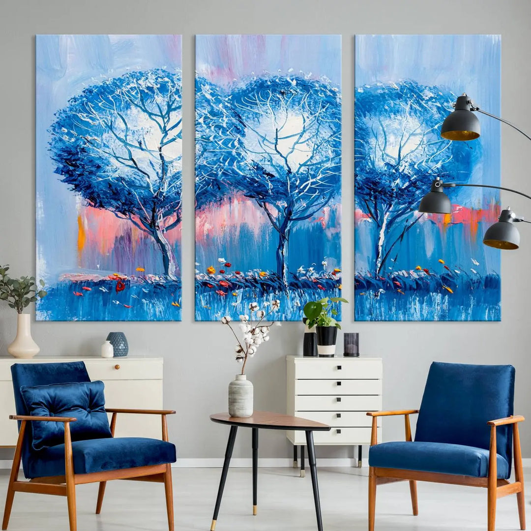 The living room showcases the Abstract Blue Trees Trendy Wall Art Canvas Print, elegantly featuring a triptych of blue trees against a pink background.