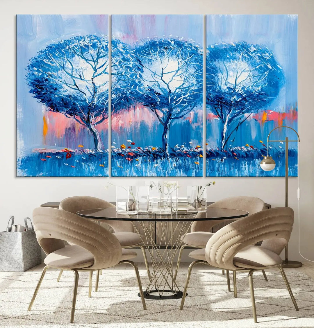 The living room showcases the Abstract Blue Trees Trendy Wall Art Canvas Print, elegantly featuring a triptych of blue trees against a pink background.