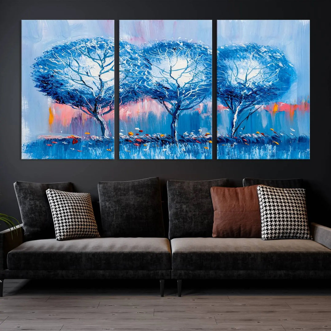 The living room showcases the Abstract Blue Trees Trendy Wall Art Canvas Print, elegantly featuring a triptych of blue trees against a pink background.