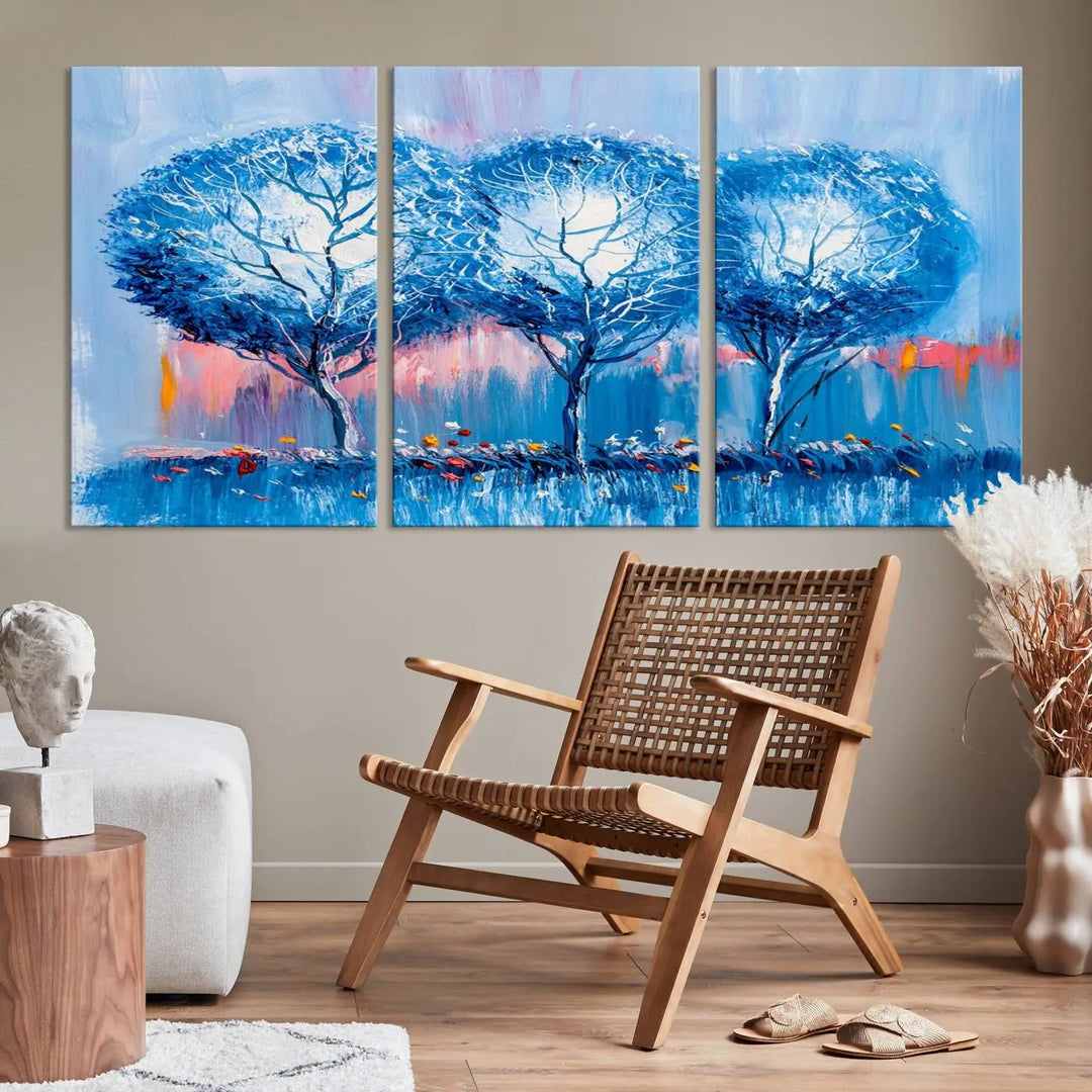 The living room showcases the Abstract Blue Trees Trendy Wall Art Canvas Print, elegantly featuring a triptych of blue trees against a pink background.