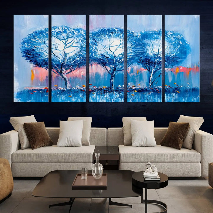 The living room showcases the Abstract Blue Trees Trendy Wall Art Canvas Print, elegantly featuring a triptych of blue trees against a pink background.