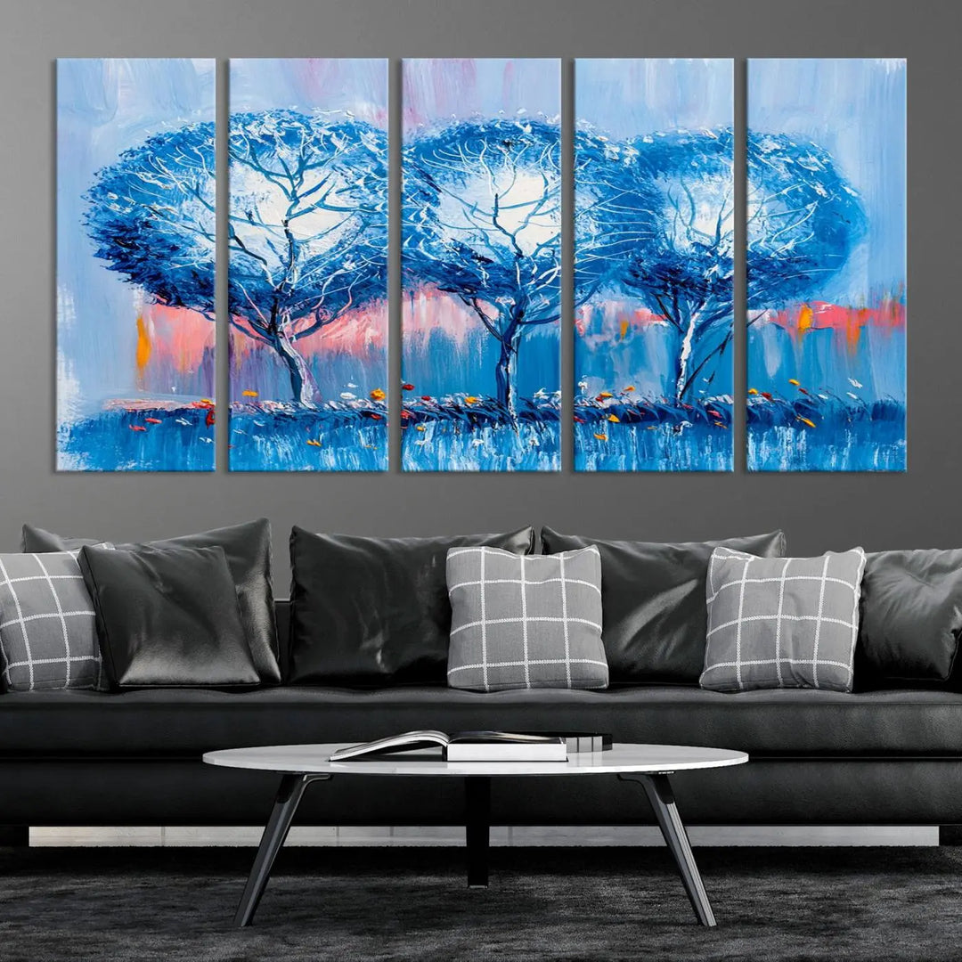 The living room showcases the Abstract Blue Trees Trendy Wall Art Canvas Print, elegantly featuring a triptych of blue trees against a pink background.