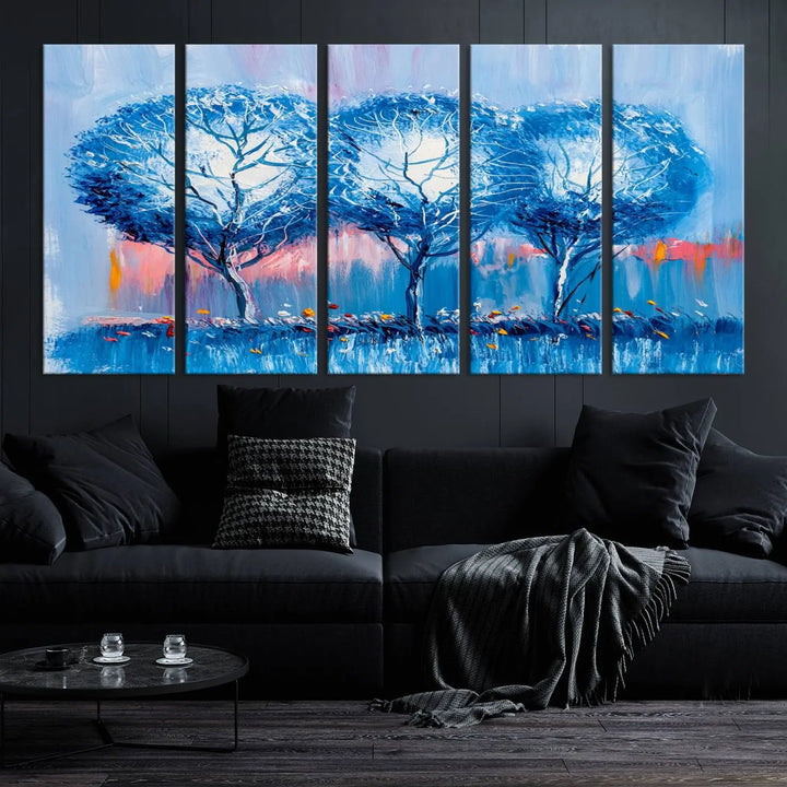 The living room showcases the Abstract Blue Trees Trendy Wall Art Canvas Print, elegantly featuring a triptych of blue trees against a pink background.