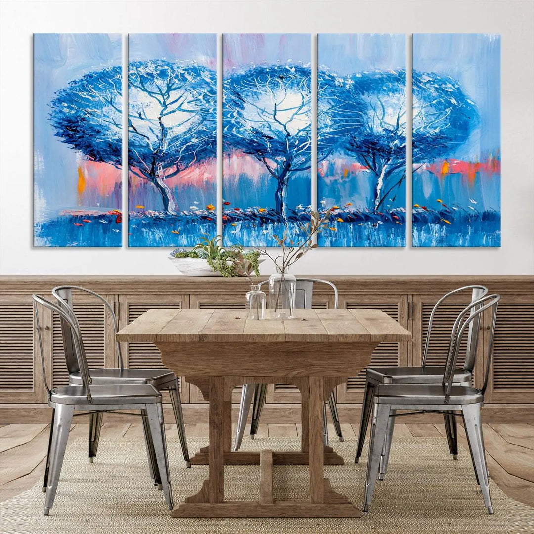 The living room showcases the Abstract Blue Trees Trendy Wall Art Canvas Print, elegantly featuring a triptych of blue trees against a pink background.