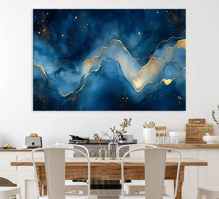 The gallery-quality Abstract Blue and Gold Canvas Wall Art hangs prominently on the wall.