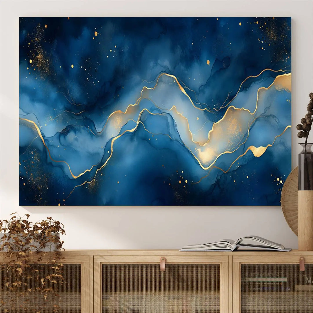 The gallery-quality Abstract Blue and Gold Canvas Wall Art hangs prominently on the wall.