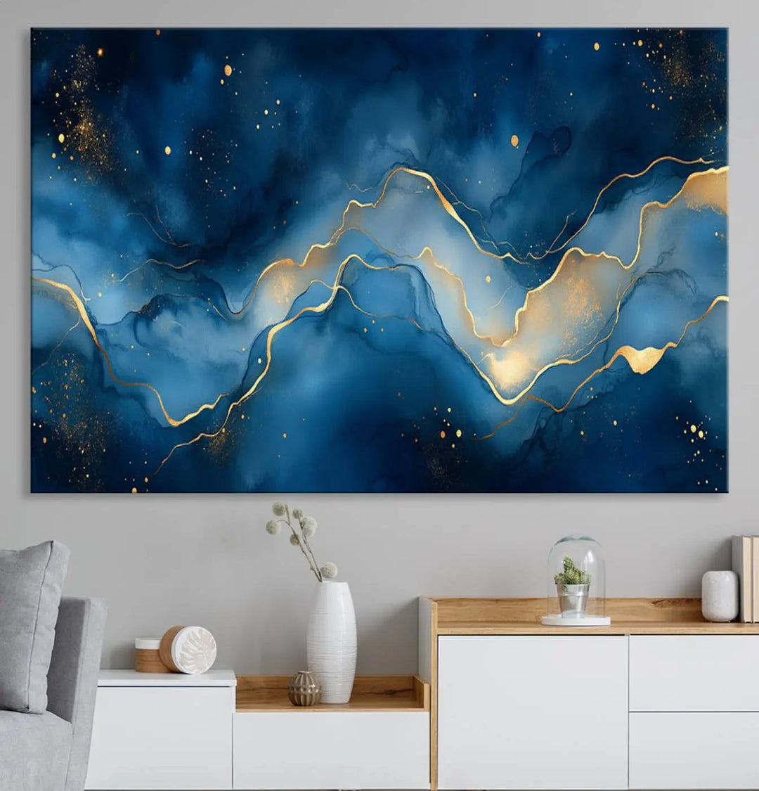 The gallery-quality Abstract Blue and Gold Canvas Wall Art hangs prominently on the wall.