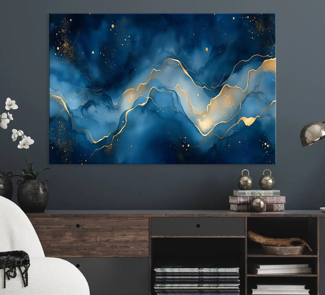 The gallery-quality Abstract Blue and Gold Canvas Wall Art hangs prominently on the wall.