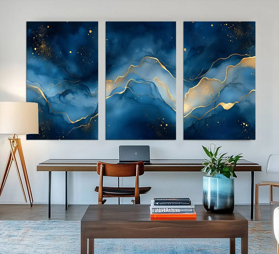 The gallery-quality Abstract Blue and Gold Canvas Wall Art hangs prominently on the wall.