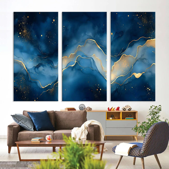 The gallery-quality Abstract Blue and Gold Canvas Wall Art hangs prominently on the wall.