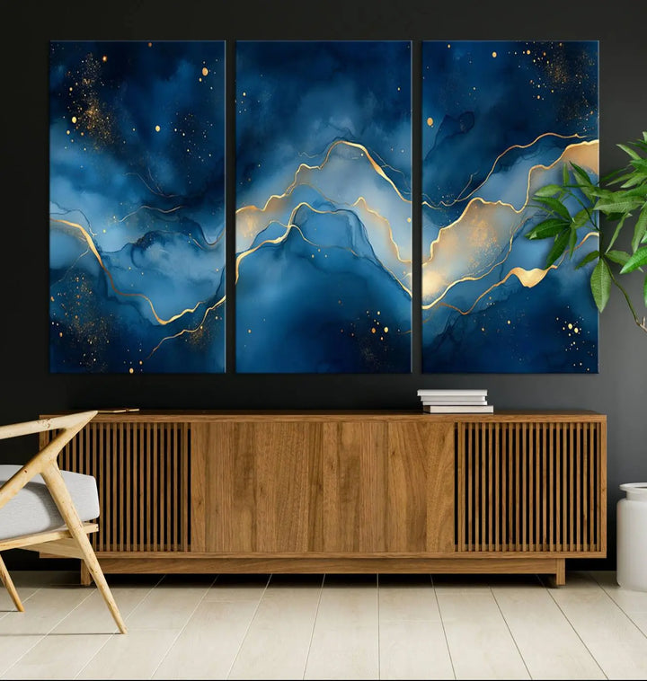 The gallery-quality Abstract Blue and Gold Canvas Wall Art hangs prominently on the wall.