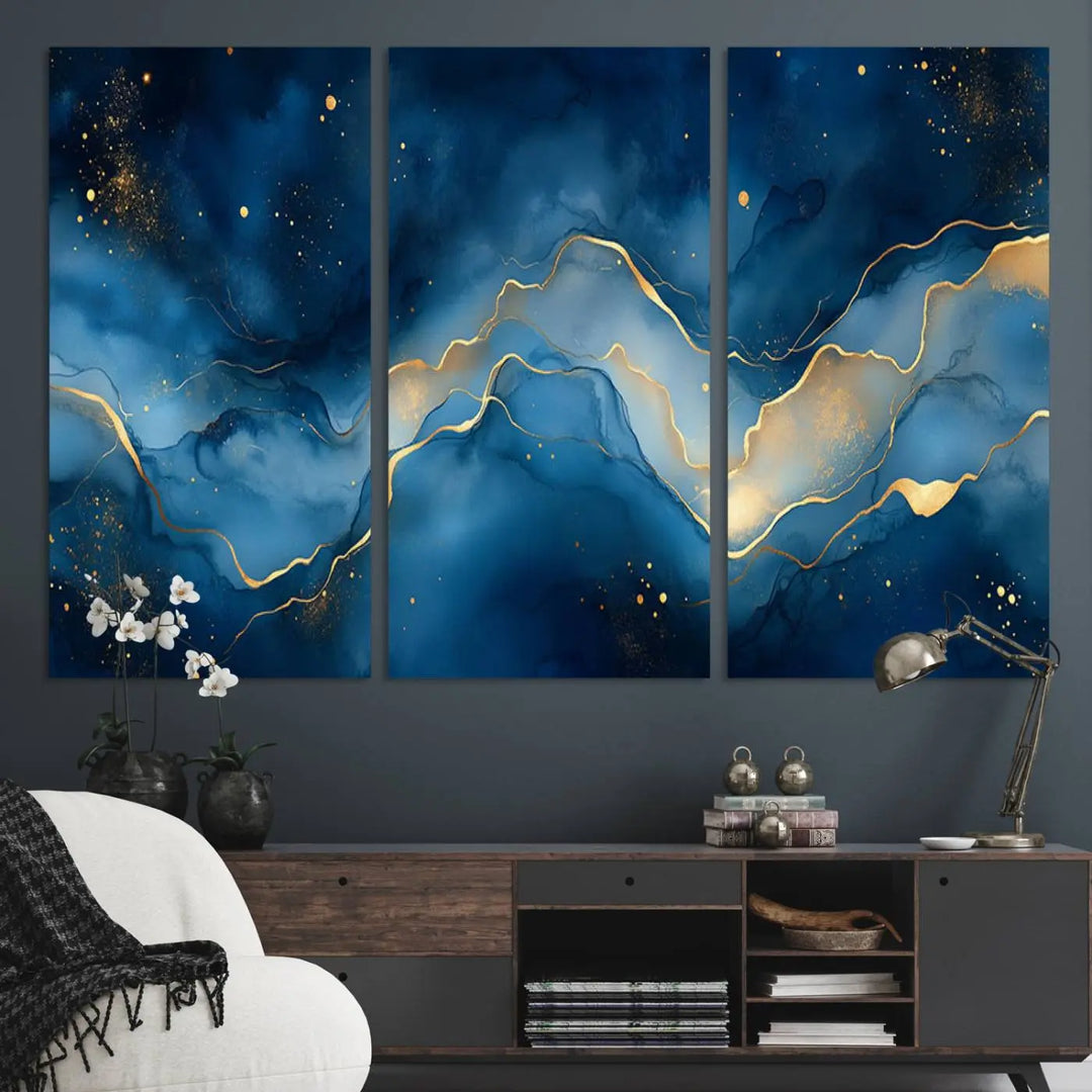 The gallery-quality Abstract Blue and Gold Canvas Wall Art hangs prominently on the wall.