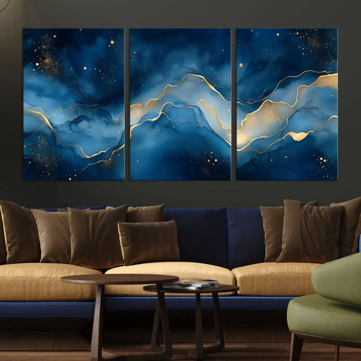 The gallery-quality Abstract Blue and Gold Canvas Wall Art hangs prominently on the wall.