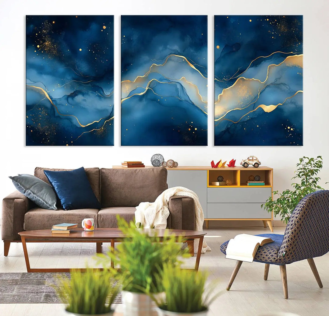 The gallery-quality Abstract Blue and Gold Canvas Wall Art hangs prominently on the wall.