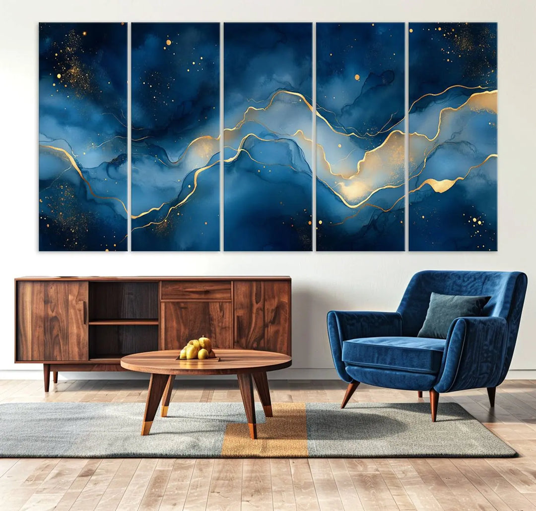 The gallery-quality Abstract Blue and Gold Canvas Wall Art hangs prominently on the wall.