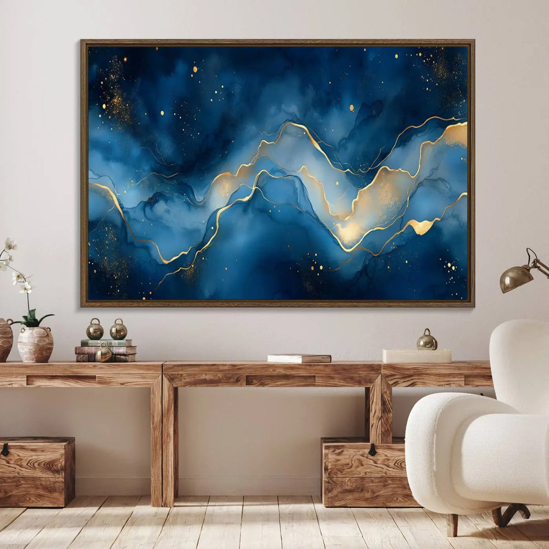 The gallery-quality Abstract Blue and Gold Canvas Wall Art hangs prominently on the wall.