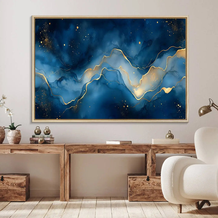 The gallery-quality Abstract Blue and Gold Canvas Wall Art hangs prominently on the wall.