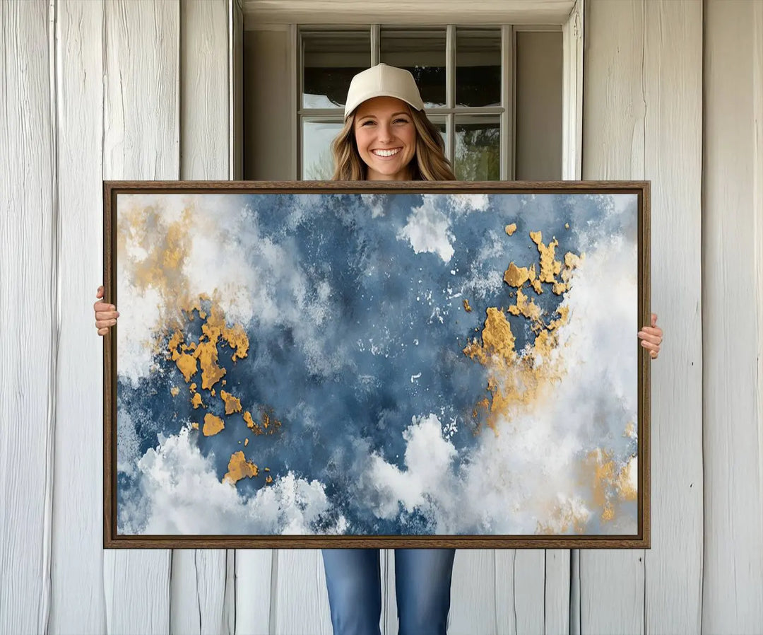The modern kitchen showcases the Abstract Blue and Gold Cloud Canvas Wall Art.