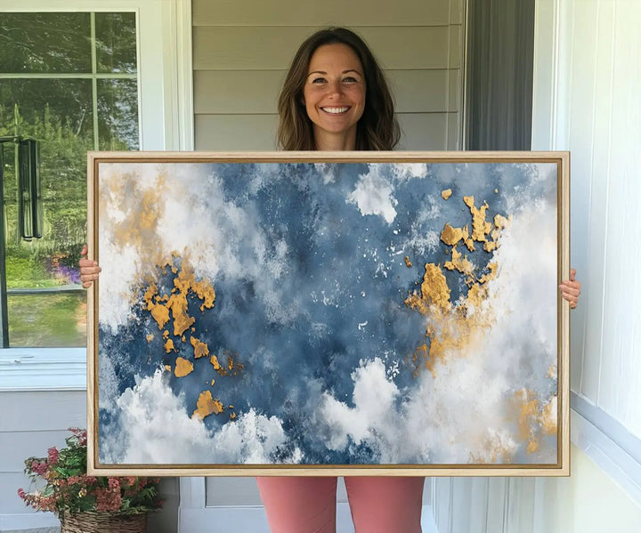 The modern kitchen showcases the Abstract Blue and Gold Cloud Canvas Wall Art.