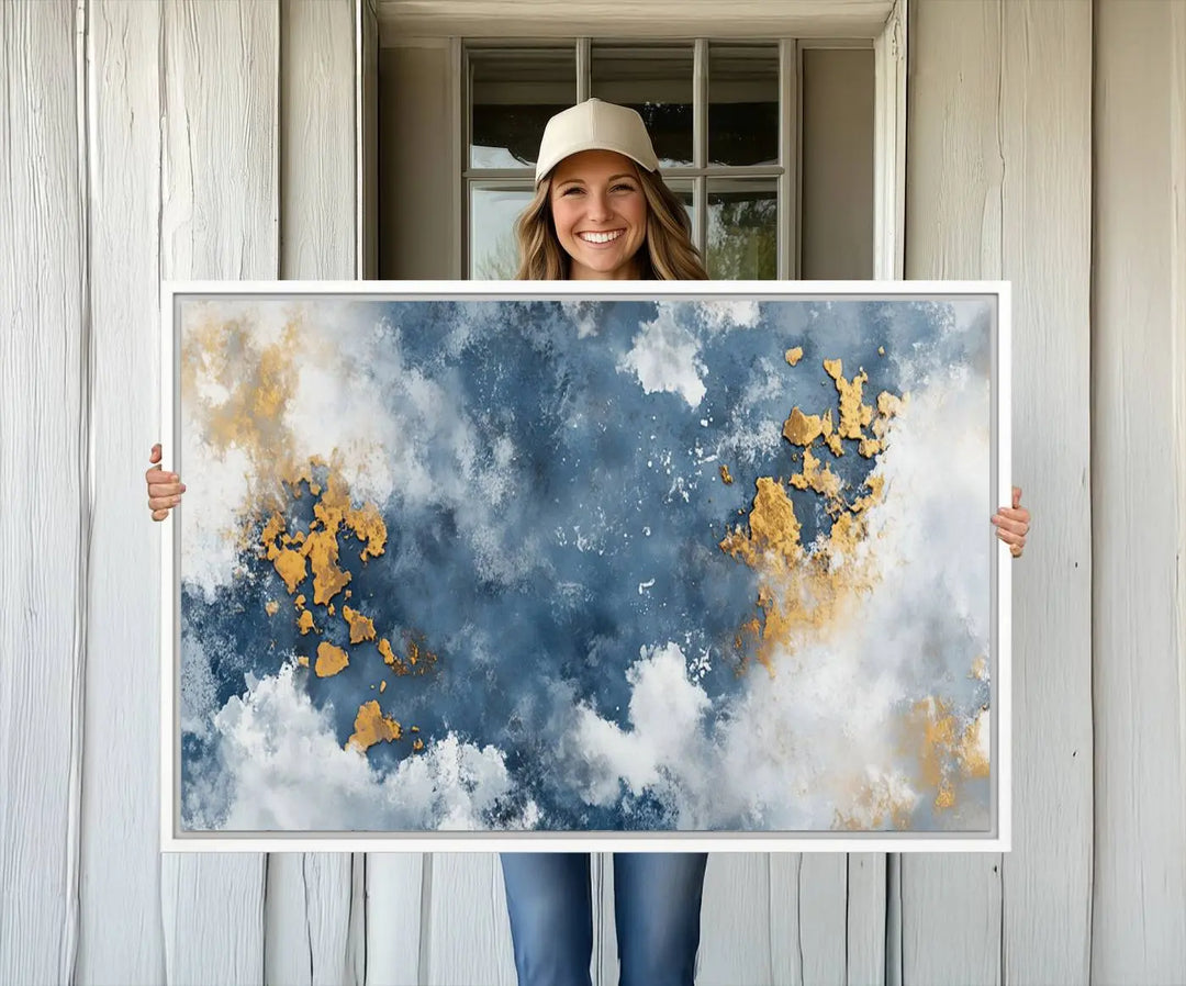 The modern kitchen showcases the Abstract Blue and Gold Cloud Canvas Wall Art.