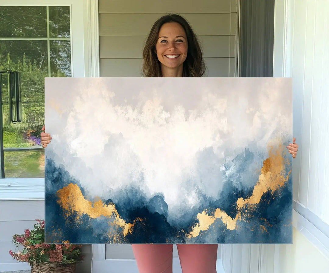 The Abstract Blue and Gold Clouds canvas art enhances the space.