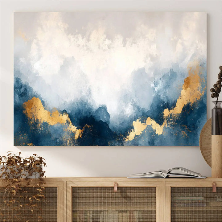 The Abstract Blue and Gold Clouds canvas art enhances the space.