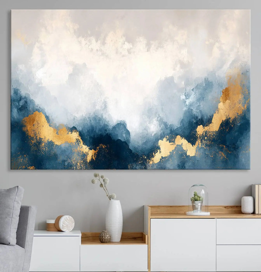 The Abstract Blue and Gold Clouds canvas art enhances the space.