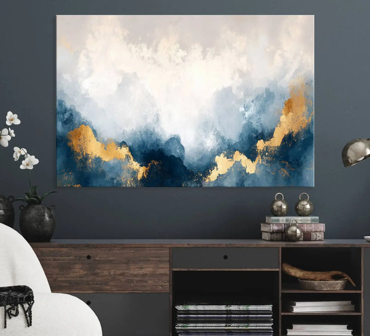 The Abstract Blue and Gold Clouds canvas art enhances the space.