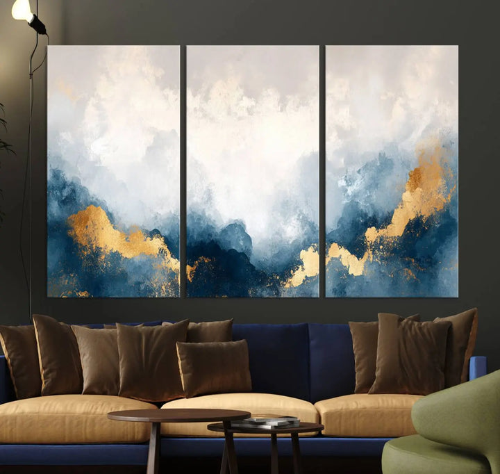 The Abstract Blue and Gold Clouds canvas art enhances the space.