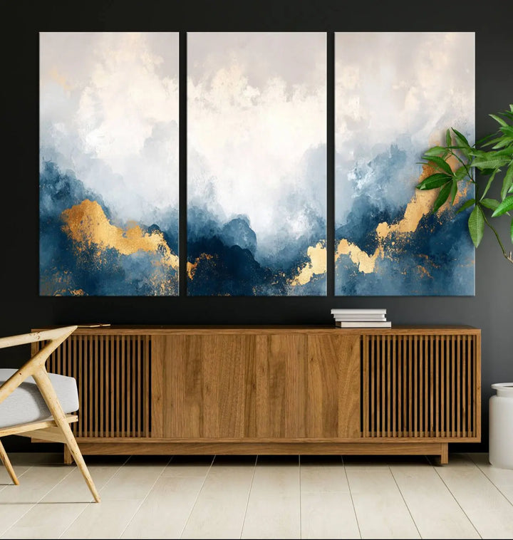 The Abstract Blue and Gold Clouds canvas art enhances the space.