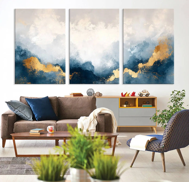 The Abstract Blue and Gold Clouds canvas art enhances the space.