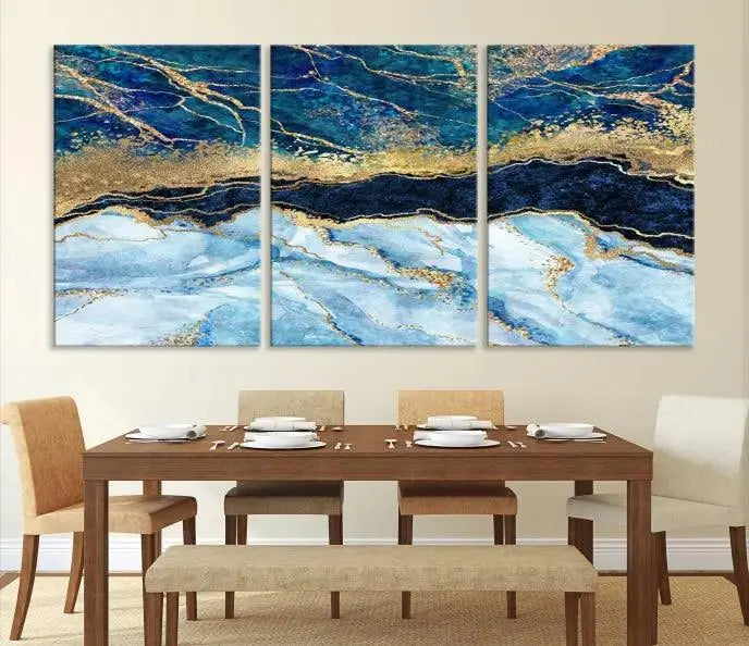 The room features a captivating Abstract Blue and Gold Marble Canvas Print displayed as a large 3-panel wall decor, infusing the space with modern elegance.