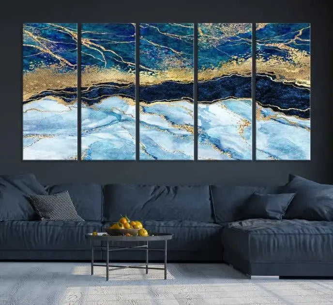 The room features a captivating Abstract Blue and Gold Marble Canvas Print displayed as a large 3-panel wall decor, infusing the space with modern elegance.